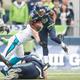 Seattle Seahawks wide receiver Tyler Lockett tries to slip a tackle during the 2015 regular season Seattle-Carolina matchup, which the Panthers won 27-23. (Photo: Rod Mar/Seattle Seahawks)
